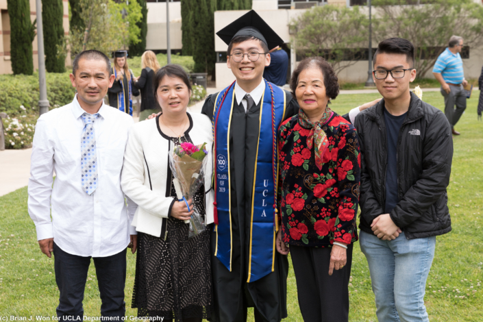Photo of newly graduated students with family and friends