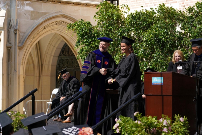 Professor Okin handing out a diploma