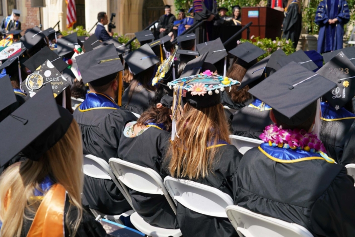 rear view of graduate's caps